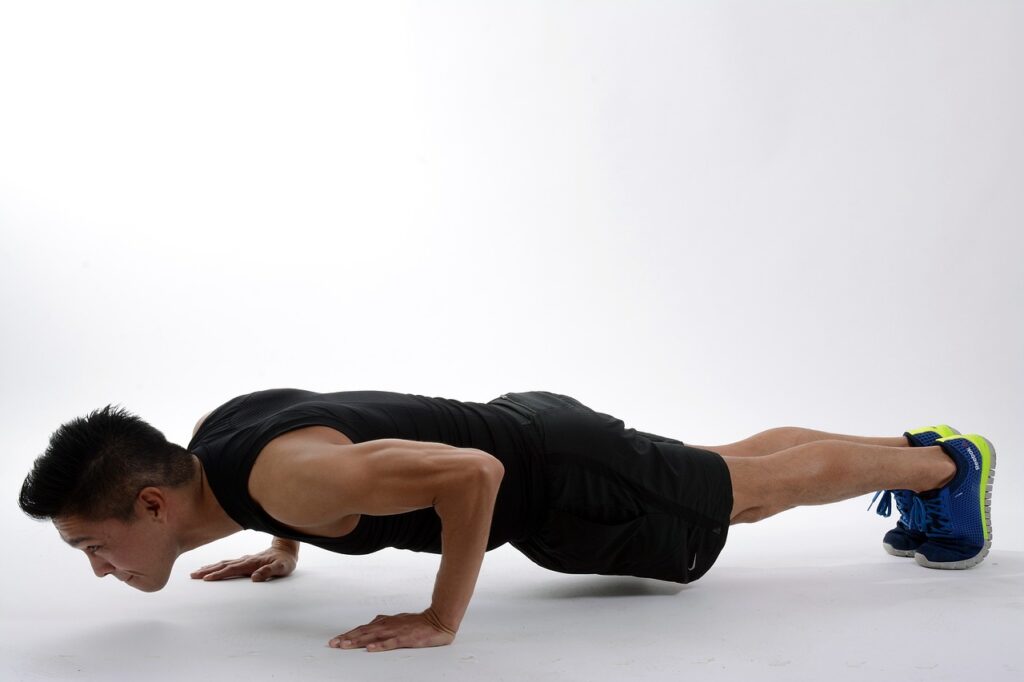 Man doing push-ups as part of the 15-minute rule routine